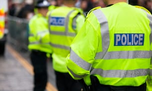A stock image of police officers from behind