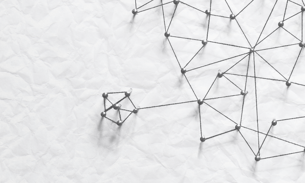 A design on a board using pins and string