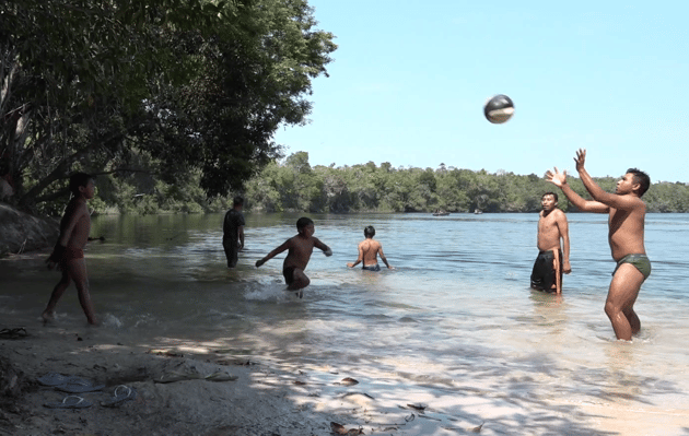 Children playing in the sea in coastal Brazil