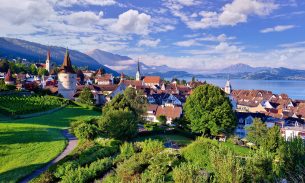 View of Zug’s old town and Lake Zug, behind it Mount Rigi and Pilatus, Canton Zug, Switzerland